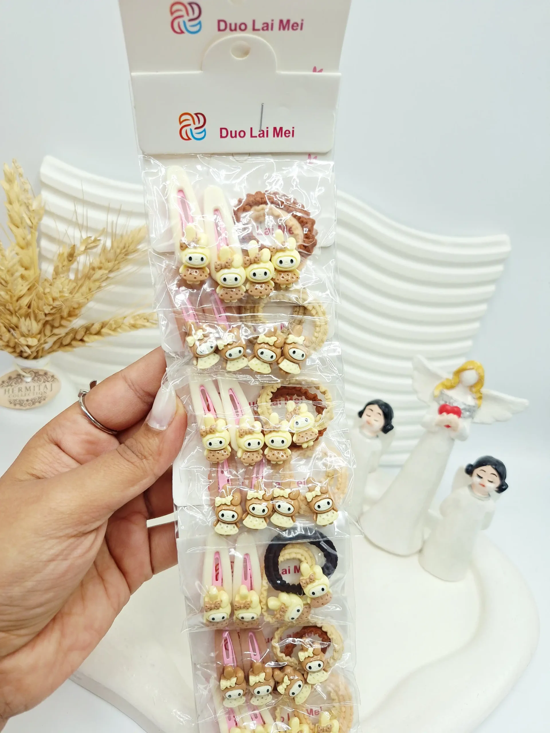 20251117112757700-thumbnail ست 10 تایی کش و پنس مو دخترانه کرومی رنگ کرم - Image 1