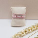 دستبند پارچه ای نگین دار CHRISTIAN DIOR (رنگ گلبهی)