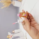 لیپ گلاس شاین دار مدل رژ طرح باربی برند Hold morning کد NO:HL5583