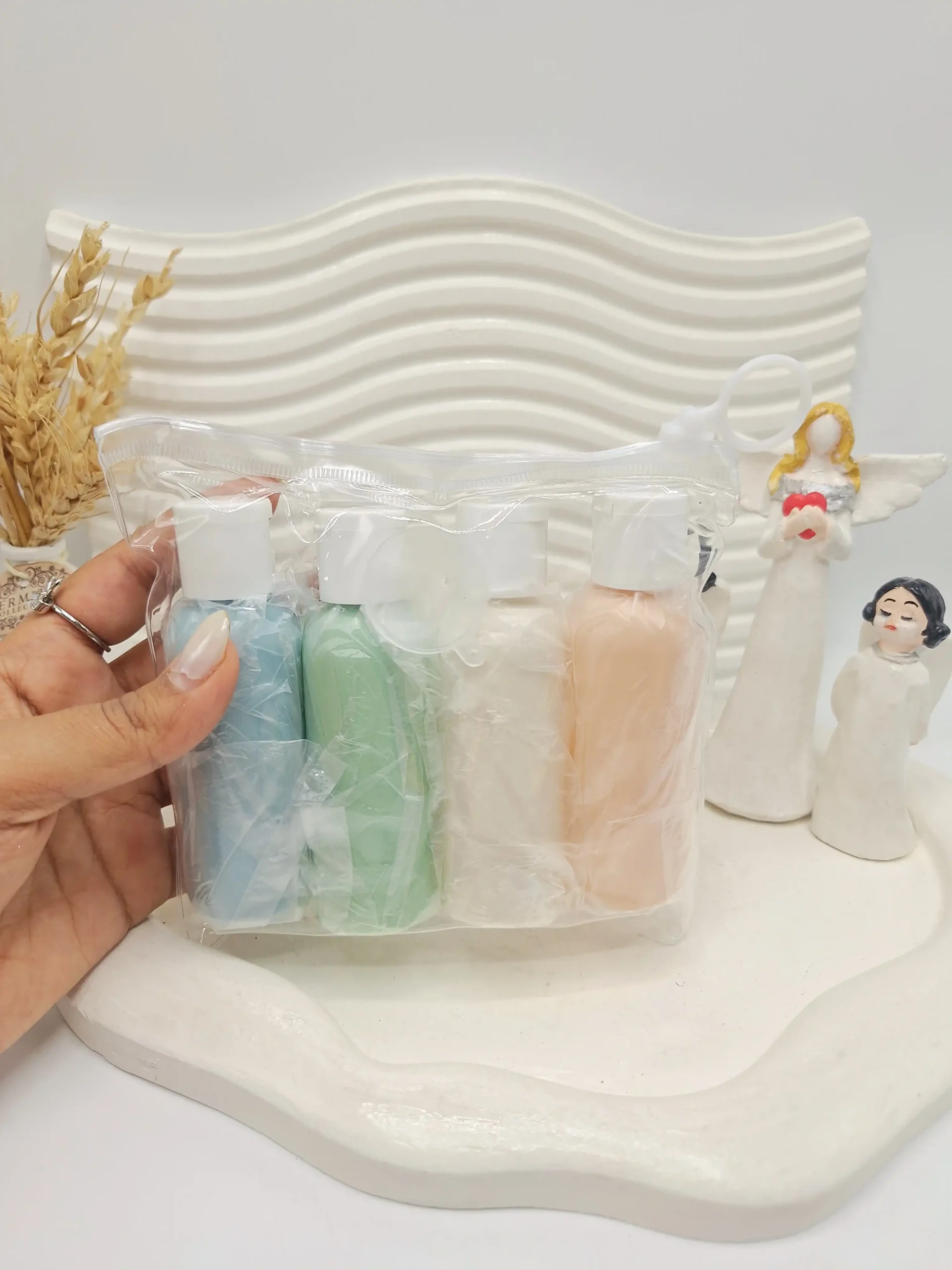 20251204224426543-thumbnail ست بطری مسافرتی سایز بزرگ 4 تیکه رنگی کاور زیپی - Image 1