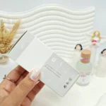 عطر بیکینی چوبی رایحه ابر رنگین کمان حجم 50 میل