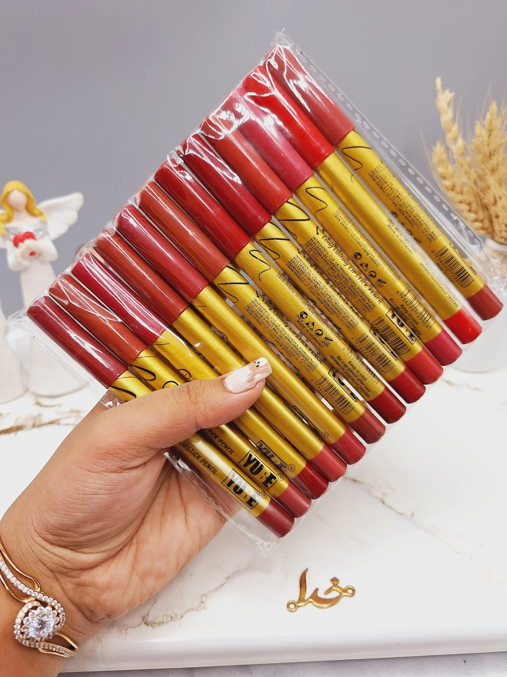 20250731052141897-thumbnail پک 12 تایی رژ مدادی برند YUBE پوکه طلایی کد A - Image 1